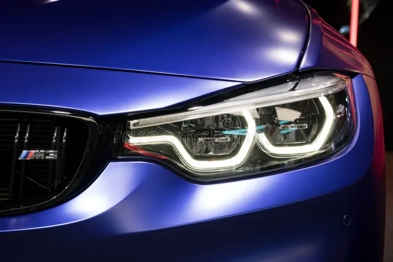 A restored and polished BMW headlight lens.